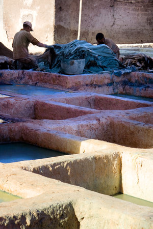 MARRAKESH, MOROCCO - JAN 21: Unidentified people perform the work in tannery souk on January 21, 2010 Within moroccan artisanal economy leather is the countrys largest exportのeditorial素材