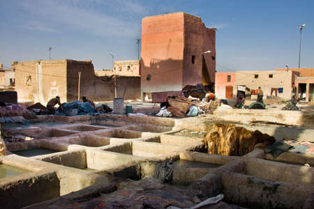 MARRAKESH, MOROCCO - JAN 21: Unidentified people perform the work in tannery souk on January 21, 2010 Within moroccan artisanal economy leather is the countrys largest exportのeditorial素材
