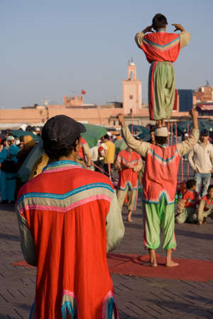 MARRAKESH, MOROCCO - JAN 21: Acrobats showing their skills for a small tip at the famous square Djema el Fna, on January 21, 2010のeditorial素材
