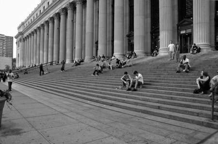 NEW YORK CITY - JUNE 26: People sitting on the stairs of New York General Post Office, in New York City, NY, on June 26, 2008のeditorial素材