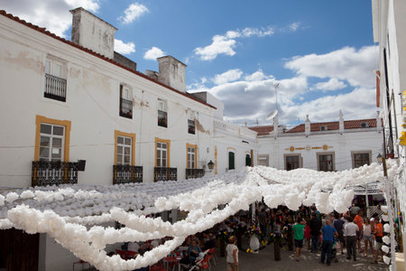 CAMPO MAIOR, PORTUGAL -23 AUGUST 2015: Flower festival in Campo Maior with hundreds of visitors walking by paper flowers decorated streets, on 23 August 2015 Campo Maior, Portugalのeditorial素材