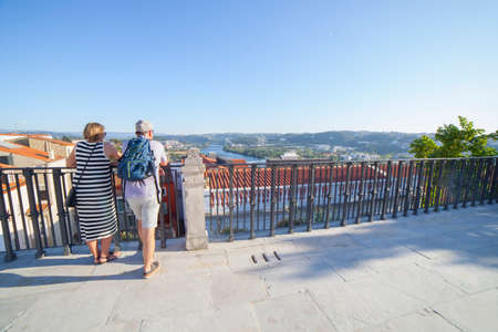 Coimbra, Portugal - Sept 6th 2019: Mature couple at viewpoint to Mondego River from University of Coimbra courtyard, Portugalのeditorial素材