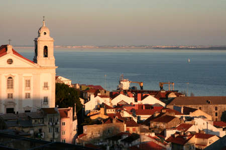 Alfama district from the miradouro viewpoint in the central Lisbon at dusk, Portugalの写真素材