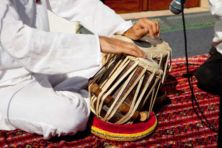 Man playing on traditional indian tabla drums. closeup view