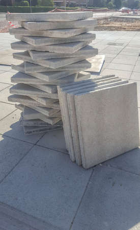 Stacks of paving slabs in piles ready to place on pavement. closeupの写真素材