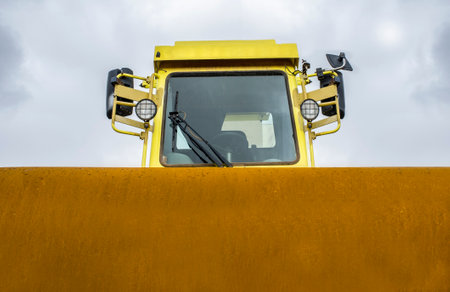 Pneumatic Tire Roller machine. Gray cloudy sky as background