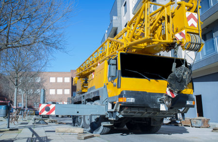 Mobile crane at construction site. Mounting crane process