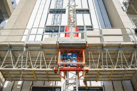 Transport Platforms of scaffold elevator at construction site. low-angle viewの写真素材