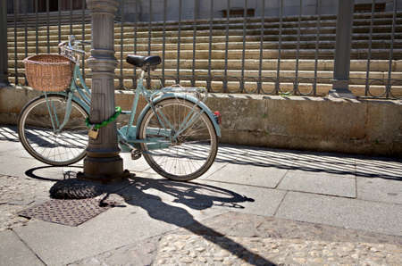Bike parked in front of the stairs of College of the Immaculate Conception, commonly called, Calatrava College, Salamancaの写真素材