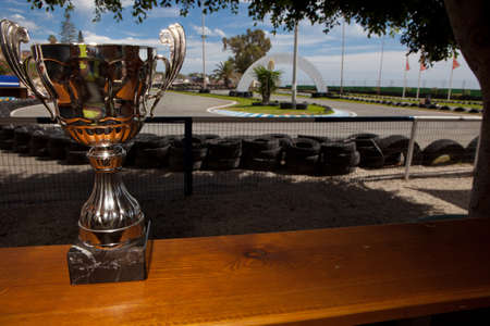 Silver cup as a price of karting competition beside the circuitのeditorial素材