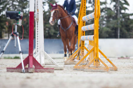 Rider observing the obstacle at competition outdoorsの写真素材