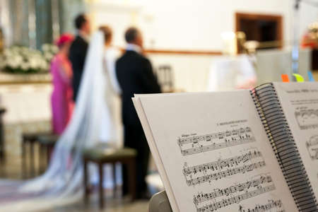 Music score over stand during the wedding ceremony in a church. selective focusの写真素材