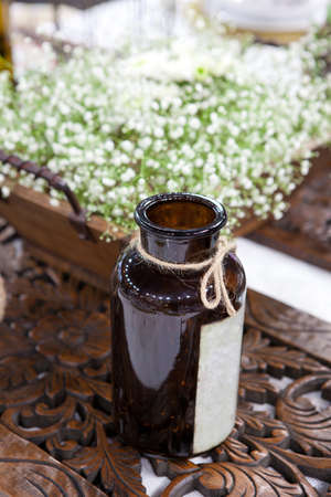 Decoration of wedding table with flowers, vases, and cagesの写真素材
