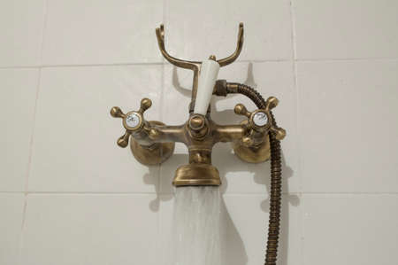 Open antique copper style bath tube faucet. water-jet