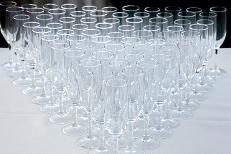 Empty champagne flute glasses. Triangular assortment