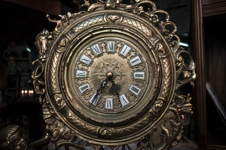 Antique brass fireplace clock. Antiques itemの写真素材