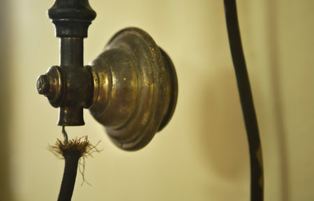 Detail of antique telephone headphone with a spoiled wireの写真素材