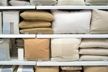 Bright pillows and bed wear on shelves. selective focusの写真素材