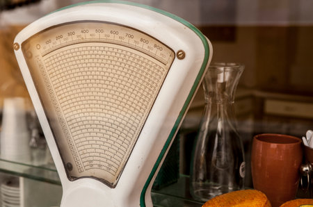 Old white vintage scale on store, Portugalの写真素材