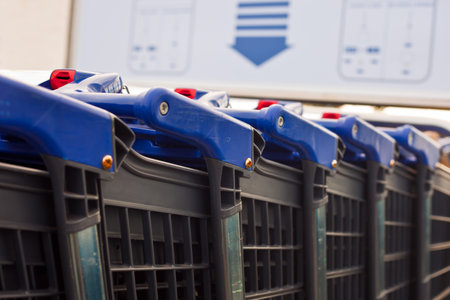 Blue shopping carts on a parking lot outside the mallの写真素材