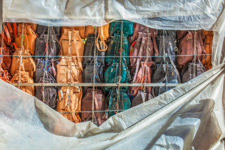 Street market stall back plenty of leather backpacksの写真素材
