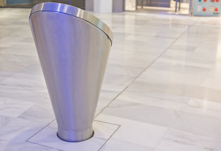 Metal information point at the mall over marble floorの写真素材