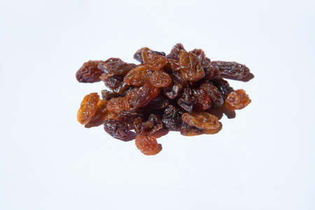 Bunch of dried grapes isolated on whiteの写真素材