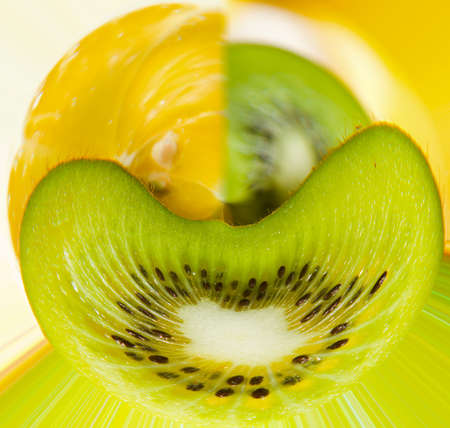 Isolated sliced half of kiwi and half of lemon. Fresh diet fruits. Healthy fruit with vitamins.の写真素材