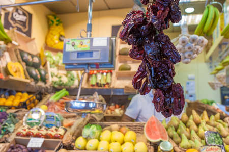Dry noras hanging at food market stall. Capsicum annum variety. selective focusの写真素材