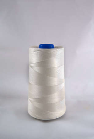 Cotton thread on spool isolated on white background