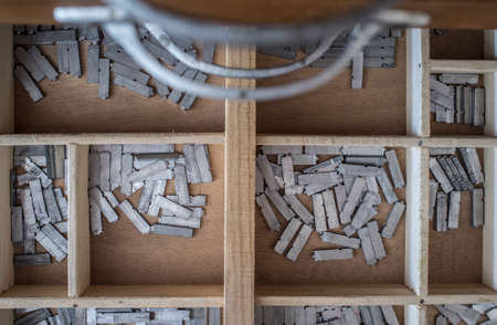 Historical printing furniture item with lettering and typing service drawers