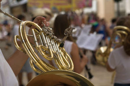Horn musician playing on the streets of Malaga during the August Malaga Fairの写真素材
