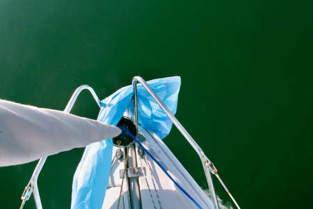 Sailboat sailing across Alange Reservoir, Spain. prow high viewの写真素材