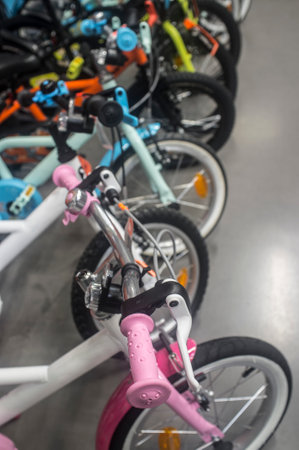 Brand new children's bicycles on asphalt for sale. selective focusの写真素材