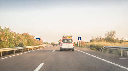 Pilot Car or Escort behind oversize load truck. View from inside the carの写真素材