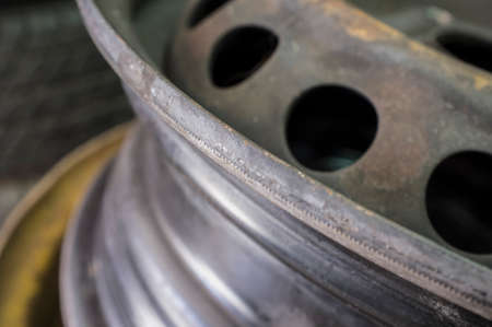 Used rims closeup. Piles of wheels waiting for repaired. closeupの写真素材