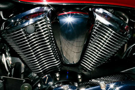 Motorbike chromed engine with starry reflections