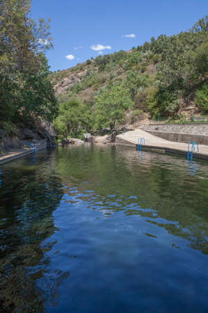 Vadillo Natural swimming pool. Crystal-clear waters spot in the heart of La Vera County. Losar de la Vera, Caceres, Extremadura, Spainの写真素材