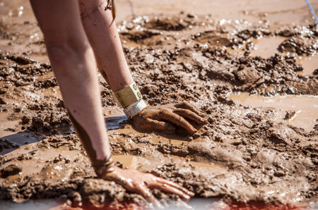 Merida, Spain - Sept 11th, 2022: FarinatoRace Merida 2022. Toughest obstacle course in the world. Crawling under wireのeditorial素材