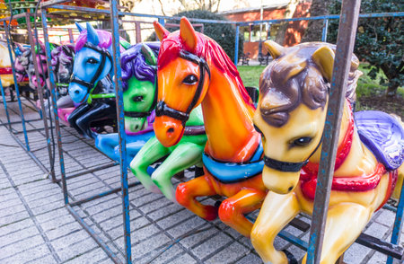 Horses out of merry-go-round placed on line. outdoor shootの写真素材