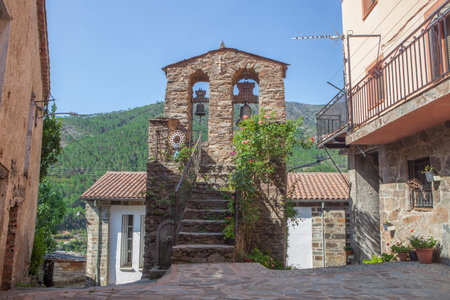Casares, beautiful little town in Las Hurdes Region, Caceres, Extremadura, Spain. isolated bell towerの写真素材