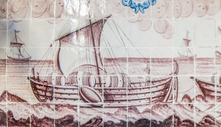 Coimbra, Portugal - Sept 6th 2019: Glazed tiles panel with maritime scene. Sao Miguel Chapel entry, Coimbra University, Portugalの写真素材