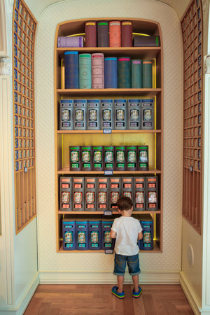 Coimbra, Portugal - Sept 7th 2019: Child boy observing shelves of Casa das Conservas, Coimbra, Portugalのeditorial素材