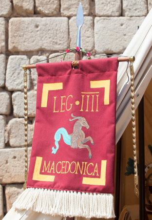 Merida, Spain - June 4th, 2023: Vexillum, roman military standard beside legionary officer tent. Emerita Ludica Festival 2023, Merida, Spainのeditorial素材