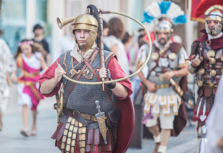 Merida, Spain - June 3th, 2023: Roman war-trumpeter performing. Emerita Ludica Festival 2023,...