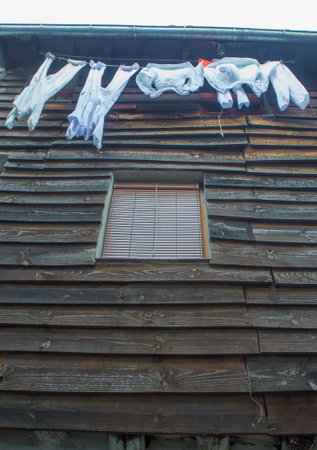Clothes hanging to dry from upper floor. Traditional architecture of Hervas, Caceres, Spainの写真素材