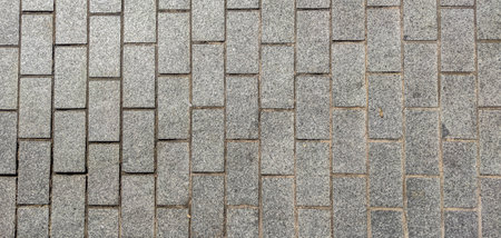 Sett pavement made with cut granite blocks. Monumental Complex road surfaces, Caceres, Spain
