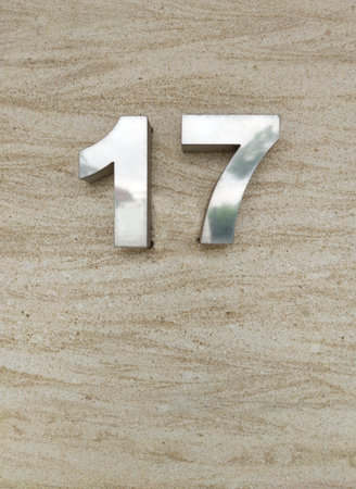 House number 17. Silver over travetine stone slate
