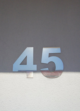 House number 45. Silver over gray wallの写真素材