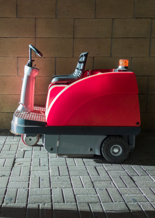 Electric Sweeper parked at airport. Sunrays illuminatedの写真素材